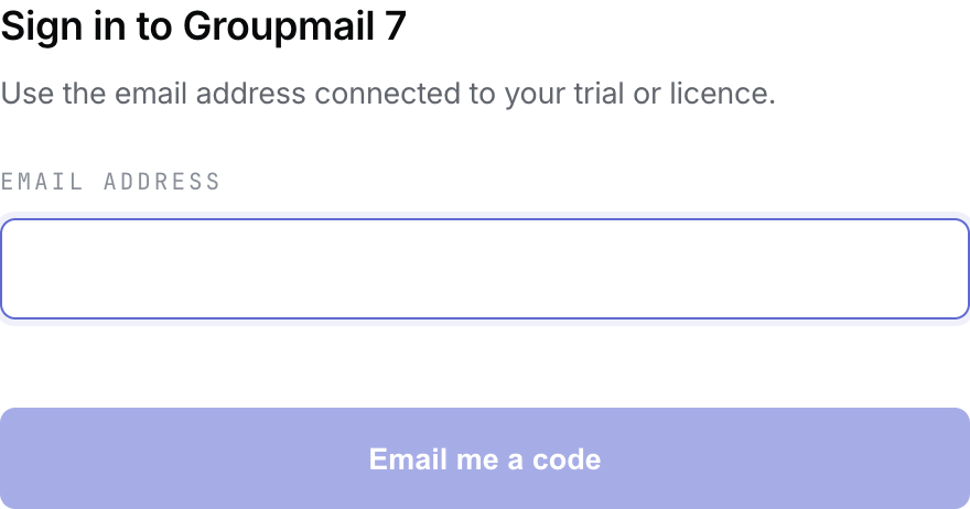 The Groupmail 7 sign-in form with an empty email field and Email me a code button.